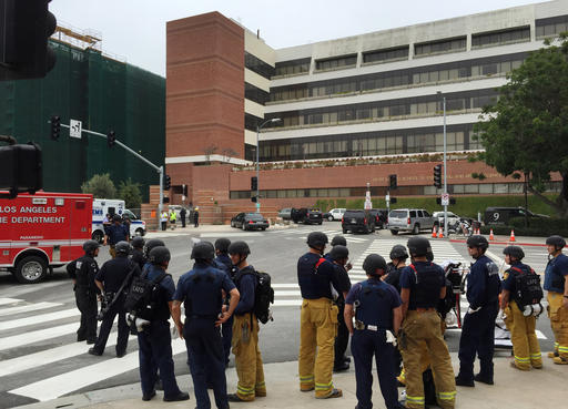 Los Angeles fire department personnel gather at the scene of a fatal shooting at the University of California, Los Angeles, Wednesday, June 1, 2016, in Los Angeles. (AP Photo/Ringo H.W. Chiu)